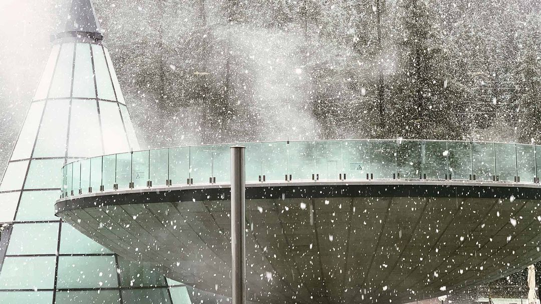 Outdoor spa pool in snow storm at the Aquadome, Austria.