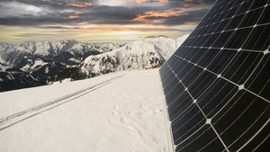 Solar panels on a snowy mountain.