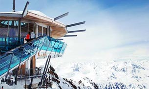 Modern mountain hut on a snowy ridge