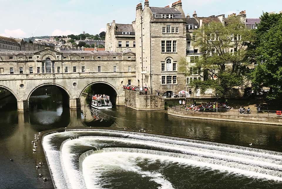 Historic bridge and weir in Bath England