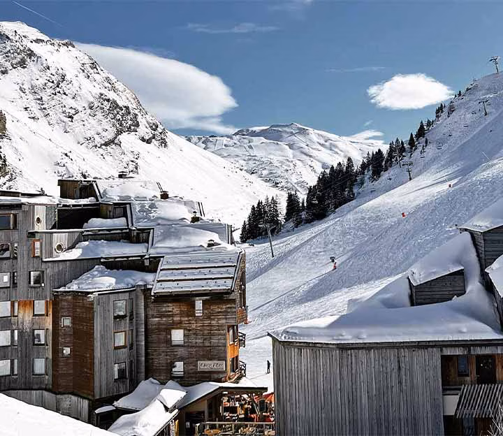 View over the mountains from a modern ski village