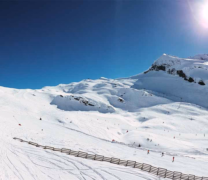 Wide open ski piste in sunny weather