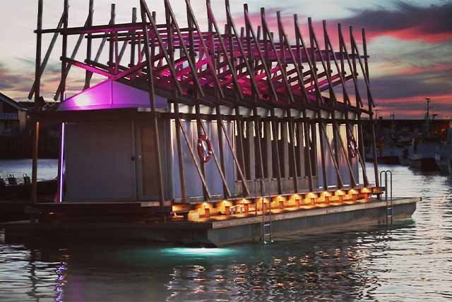 Floating sauna in a harbour in arctic Norway