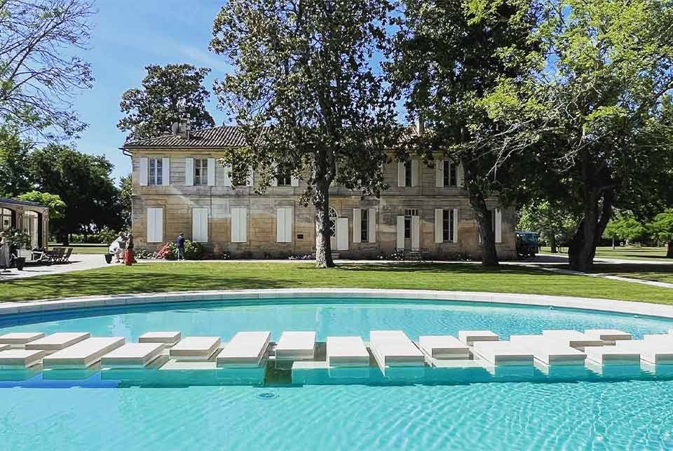 Pool in front of a French chateau.