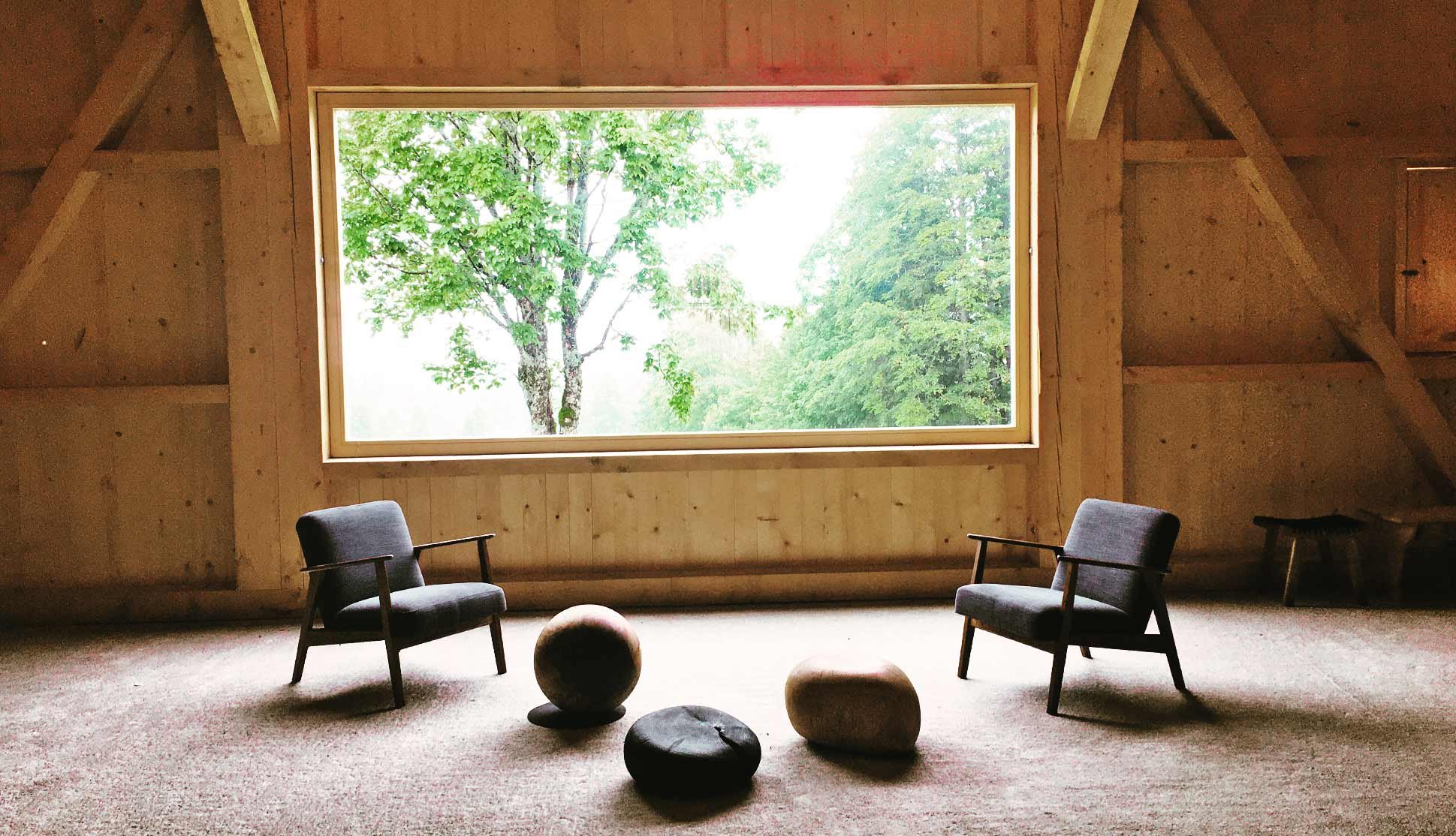 Chairs in front of a window in an eco-hotel