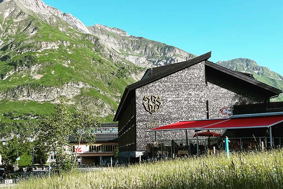 Stone building in a field in the mountains