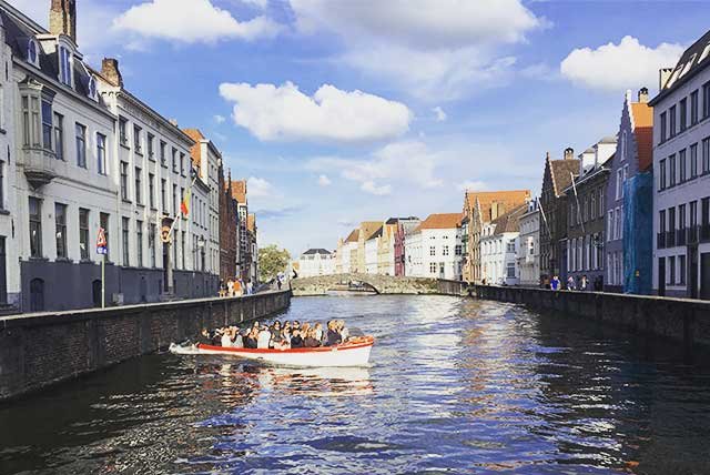 Boat sailing on a canal in Bruges