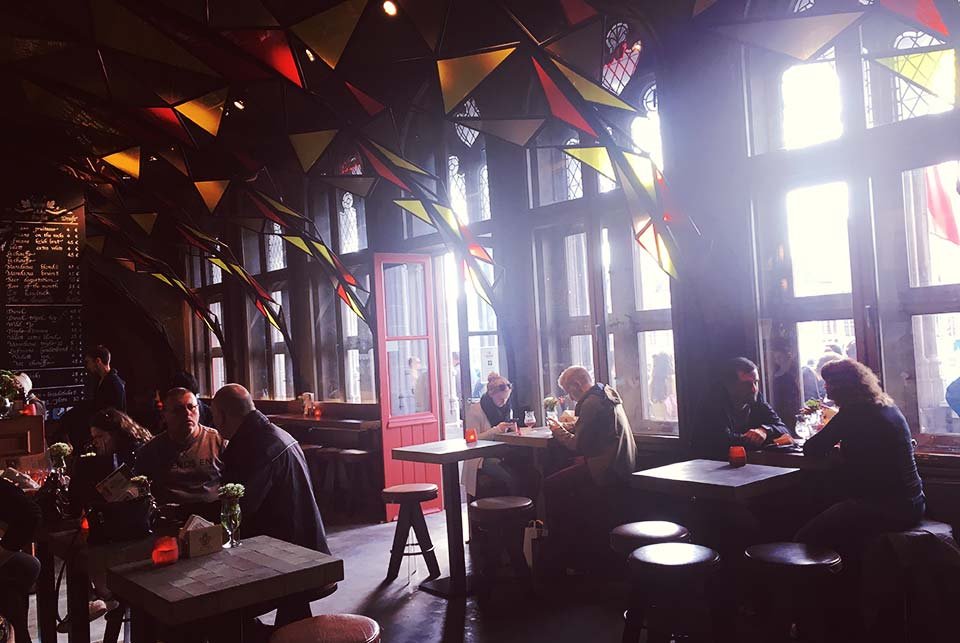 Light coming through a window in a Bruges bar