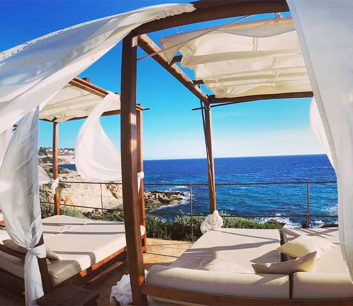 Wind blowing through sun loungers on the coast