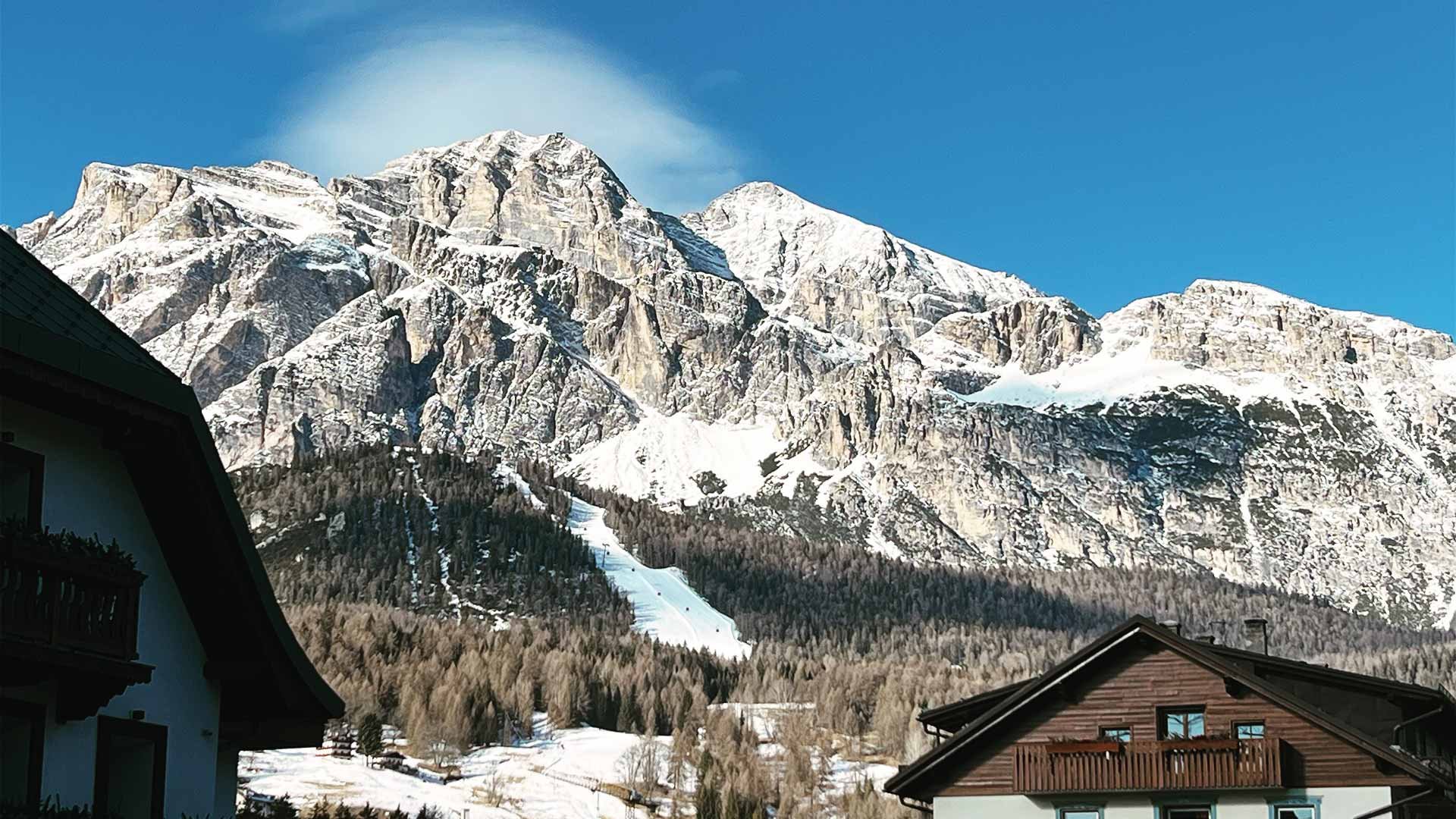 View over rooftops of the Dolomite mountains