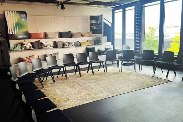 Seats curving around a meeting room
