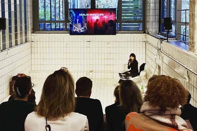 People attending a meeting in a swimming pool