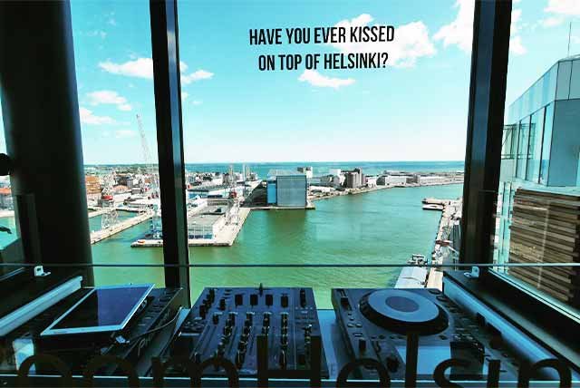 DJ deck in front of a harbourside window