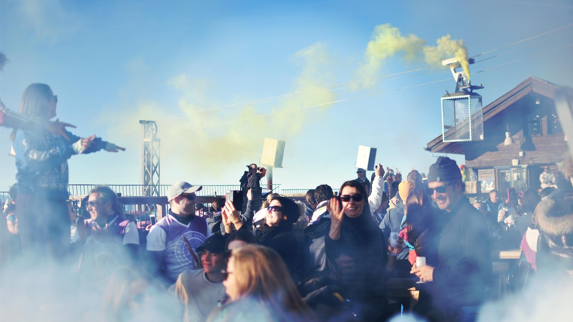 People on a smoke filled apres ski terrace