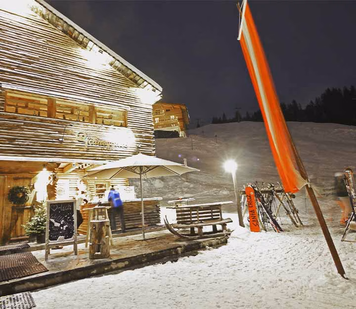 Mountain hut on the snow at night