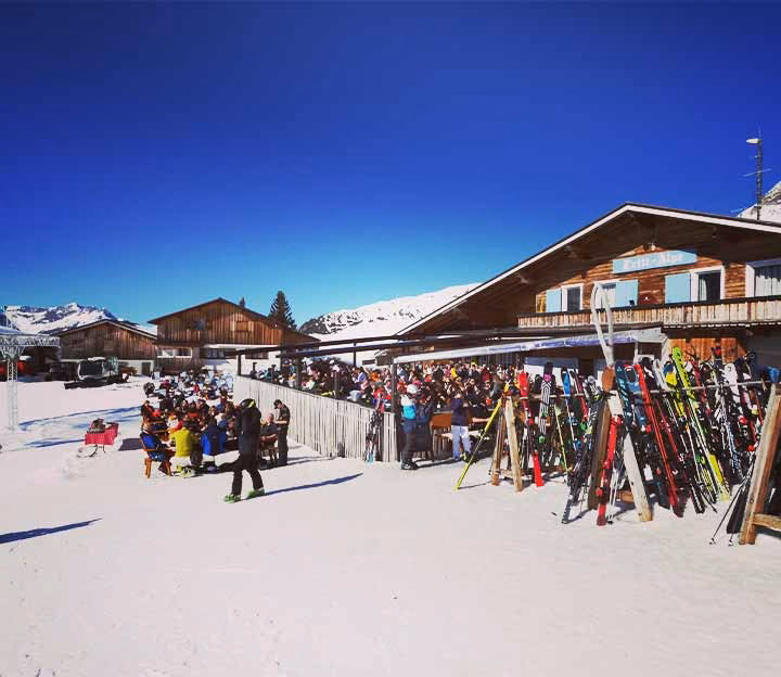 Skis outside a mountain hut and terrace
