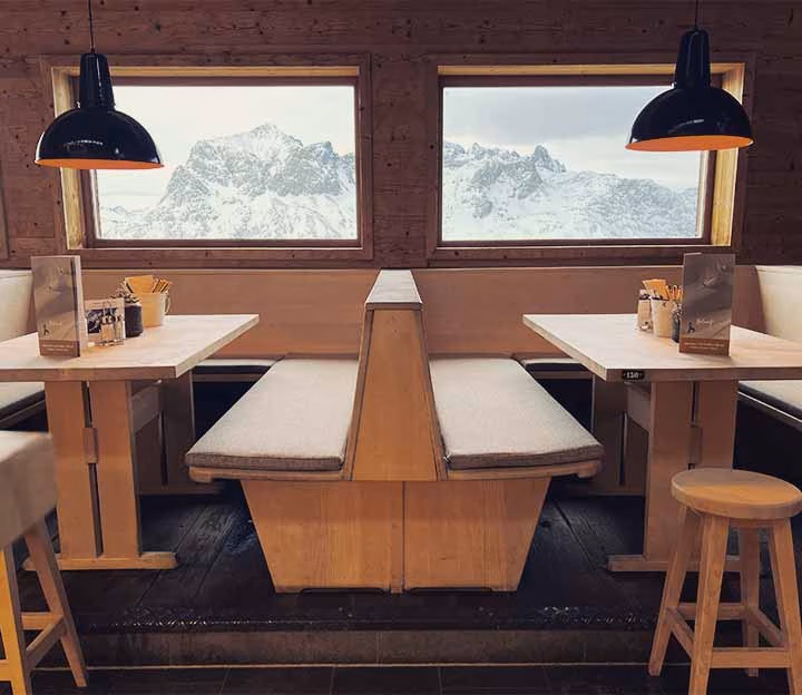 Table in a wooden hut overlooking the mountains