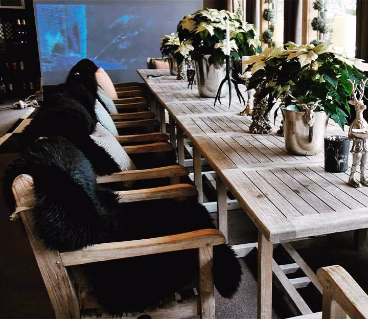 Meeting table with flowers and a screen