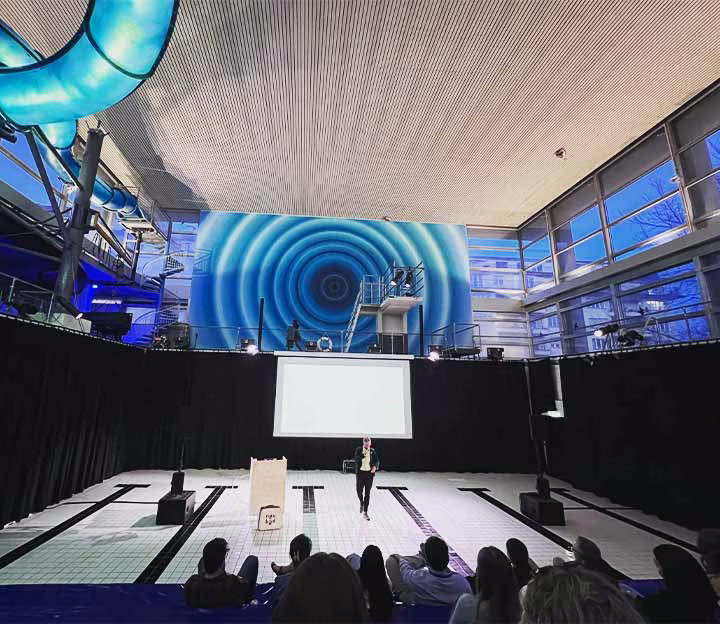 People attending a meeting in a swimming pool