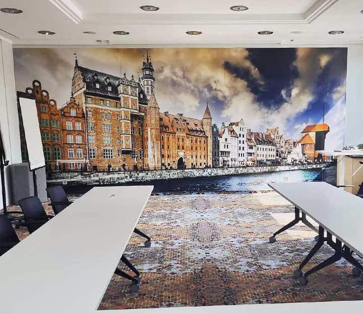 Colourful meeting room with table and painting