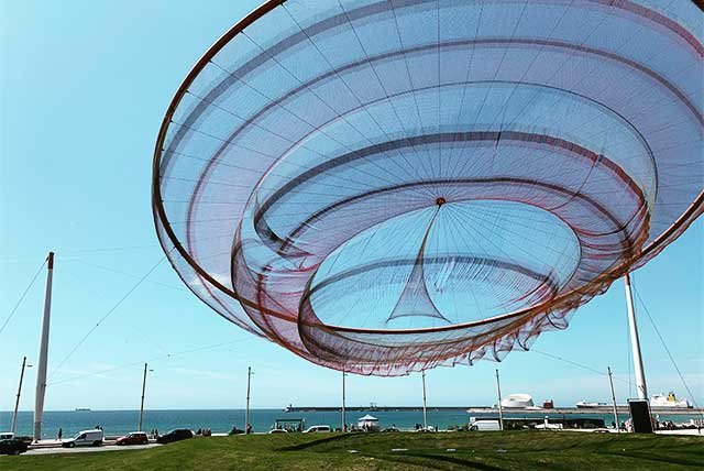 Large art installation of a net hanging in the air