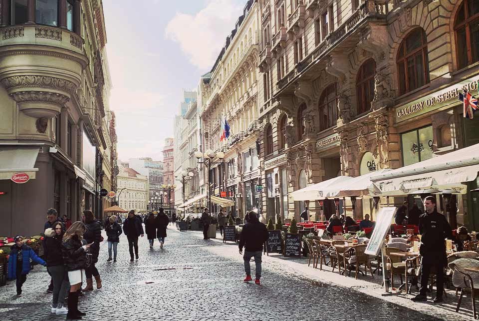 People walking on a street in central Prague