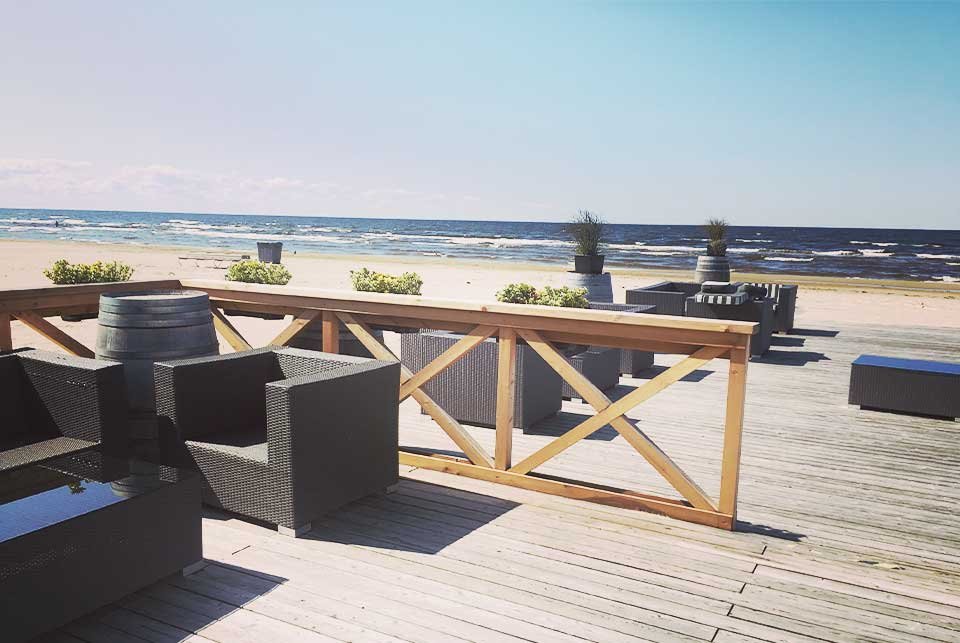 Beach front terrace with furniture