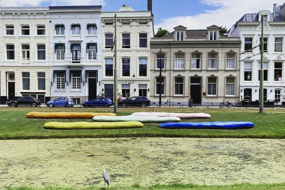 Colourful seats in a canal-side park