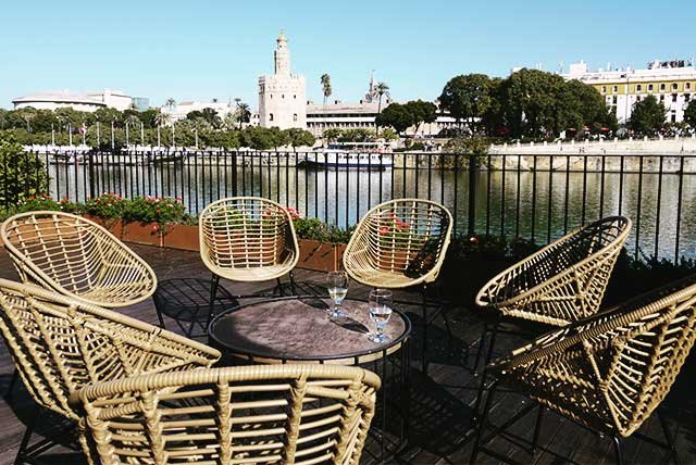 Chairs on a riverside terrace