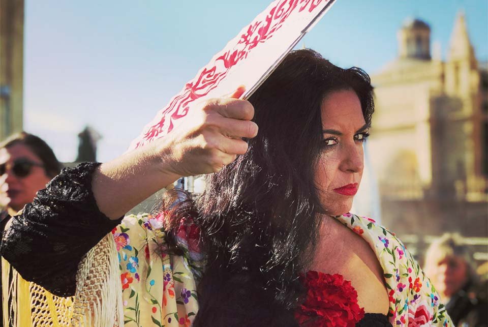 Flamenco dancer waving a fan