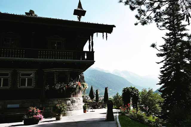A wooden building in the mountains