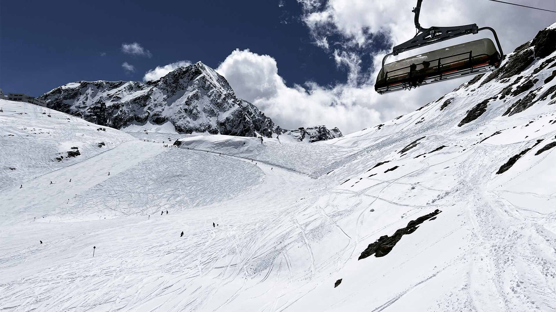 View over a ski piste from a chair lift