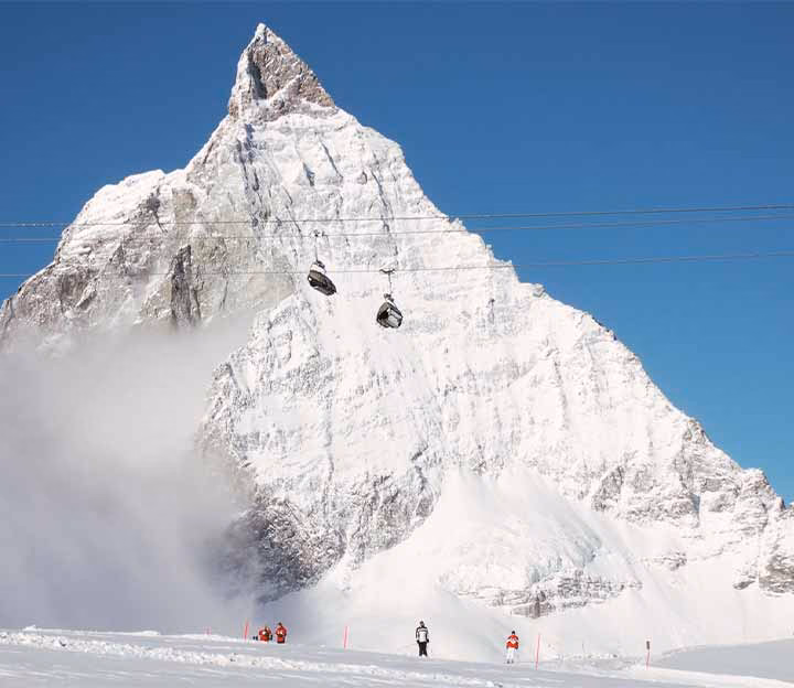 Skiers in front of the Matterhorn