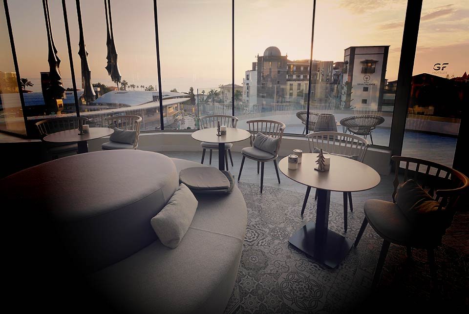 Event venue with windows looking out to sunset