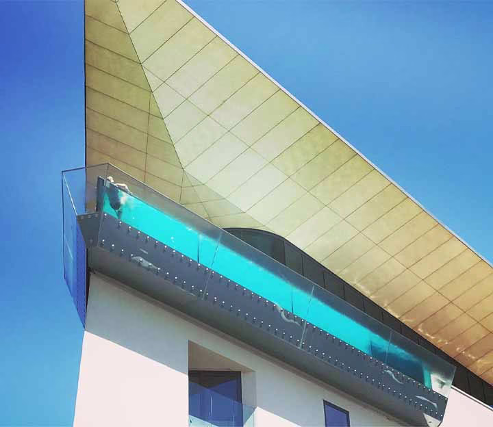 Person floating in a rooftop spa