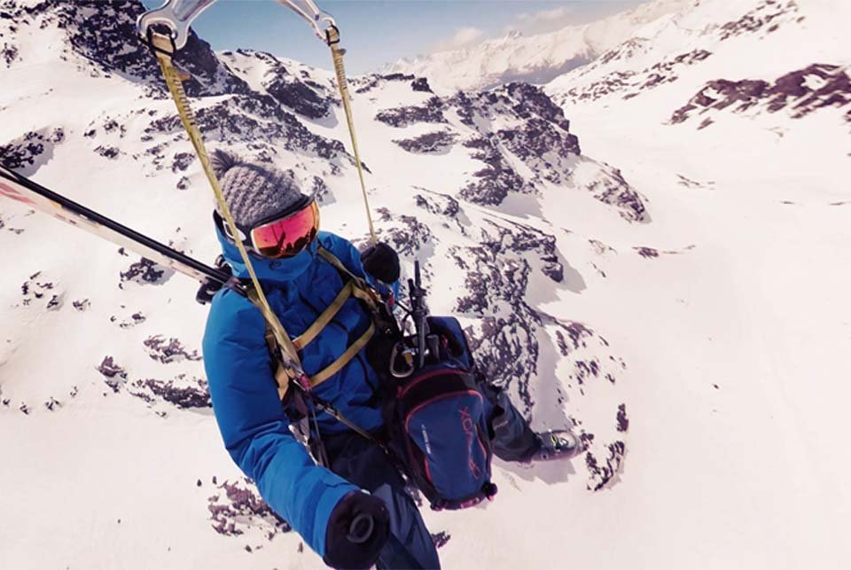 A person on a zip wire in the mountains