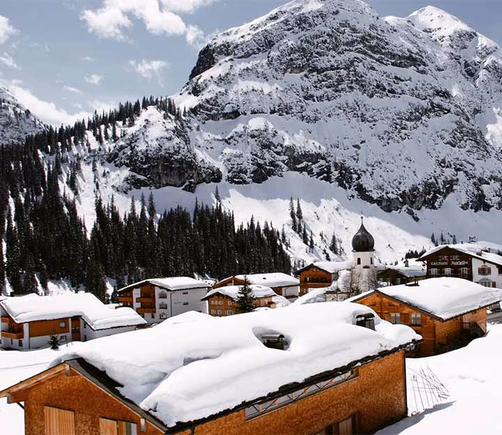 Small ski resort with buildings covered in snow